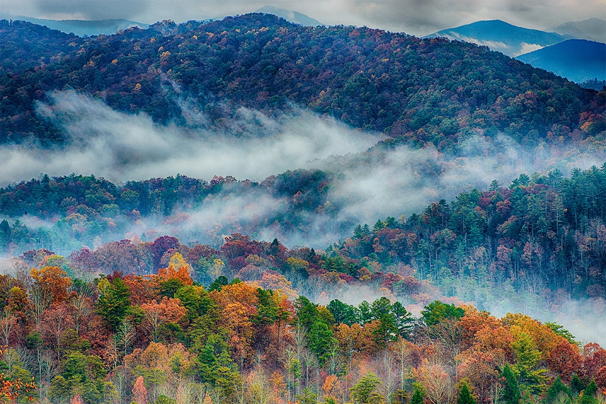 Landslide Background Slider colorful fall foliages with clouds hovering over